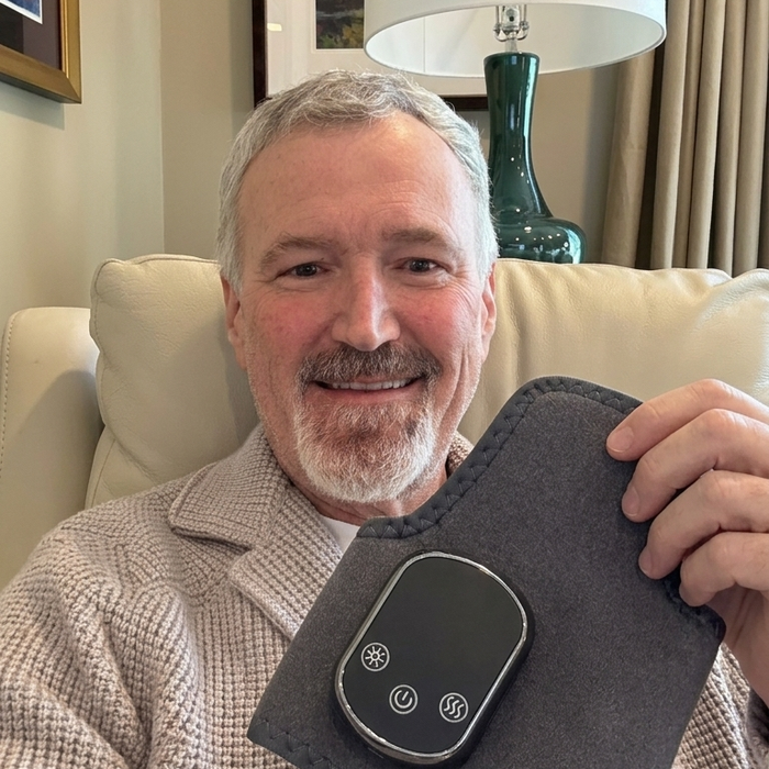 James W. holding the TheraPrime ankle system - reviewer photo
